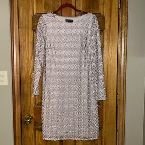 Beige, long, sleeved mother of the bride dress.